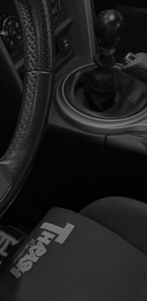 interior of car, manual shifter and aftermarket bucket seat